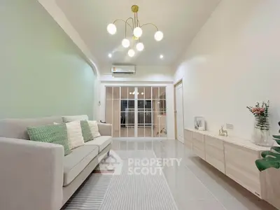 Modern living room with elegant lighting and stylish decor