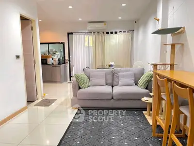 Charming living room with cozy sofa and modern decor in a bright, open layout apartment.