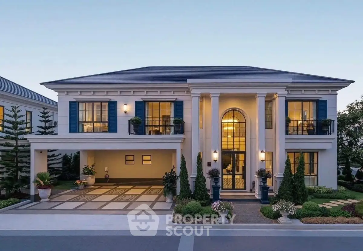 Luxurious two-story mansion with grand entrance and elegant landscaping at dusk.