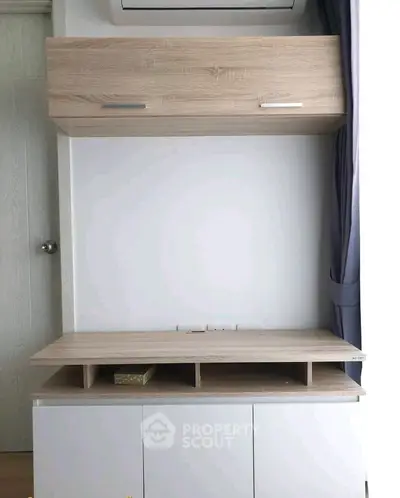 Modern minimalist storage unit with air conditioning in a stylish interior space.