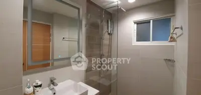 Modern bathroom with sleek design and glass shower enclosure