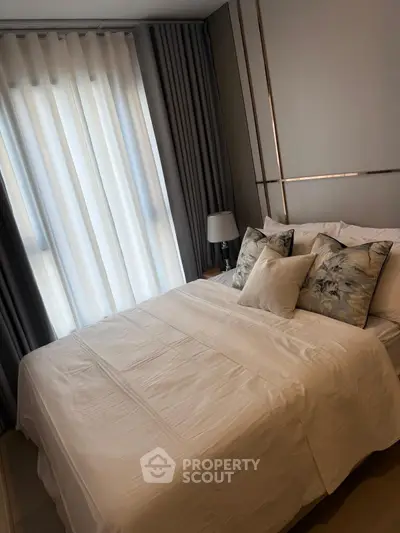 Cozy and elegant bedroom with soft lighting and luxurious bedding