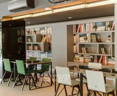 Modern study area with sleek tables and bookshelves, ideal for co-working or library space.