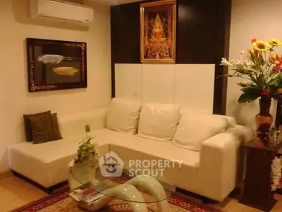 Elegant living room with white sectional sofa and stylish decor