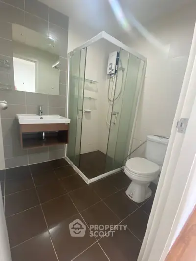 Modern bathroom with glass shower and sleek fixtures