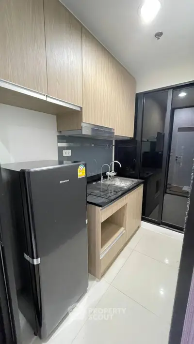 Modern kitchen with sleek cabinetry and stainless steel appliances