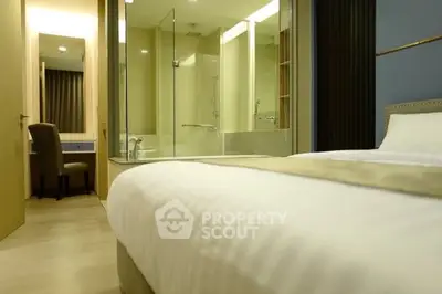 Modern bedroom with ensuite bathroom and elegant decor