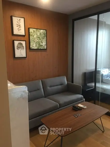 Modern living room with stylish decor and comfortable seating in a cozy apartment.