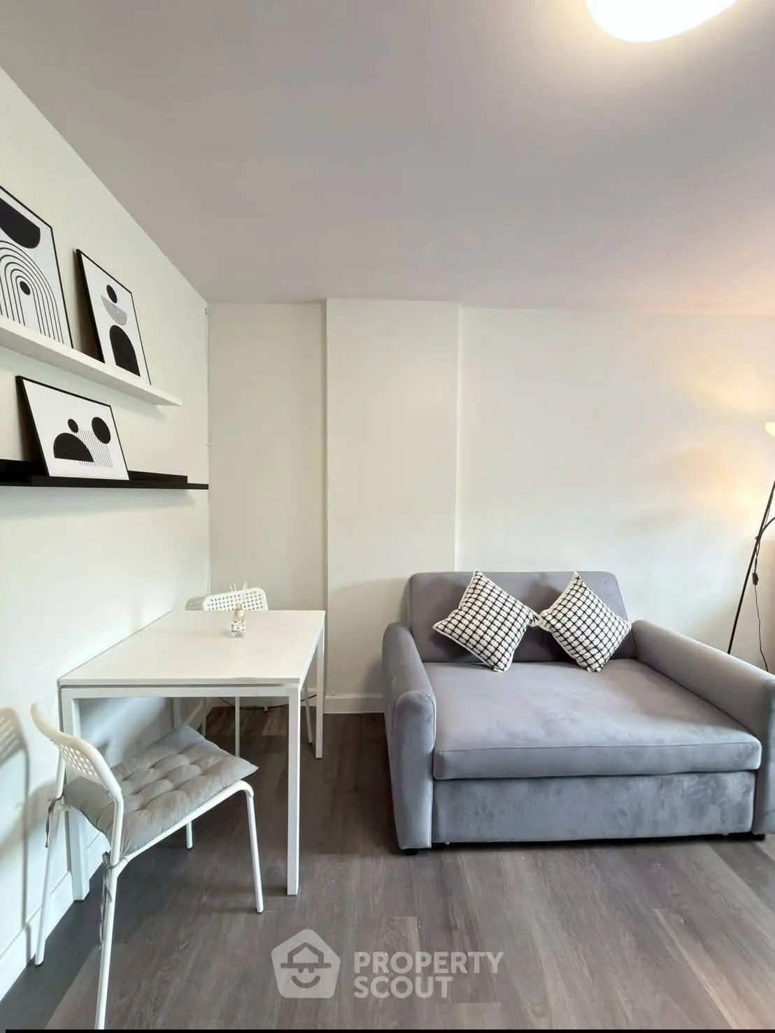 Modern living room with stylish decor and cozy seating area, perfect for relaxation and entertaining.