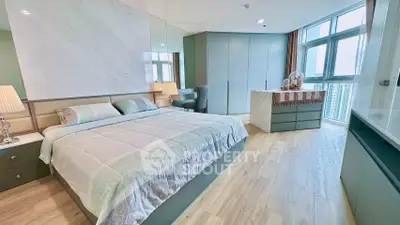 Luxurious bedroom with modern decor and stunning city view, featuring elegant furnishings and ample natural light.