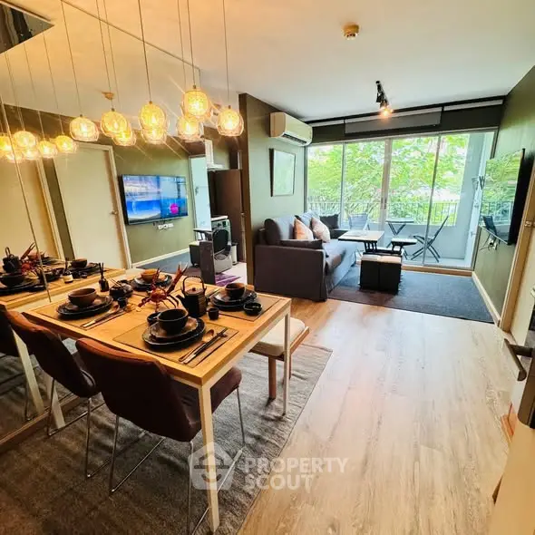 Modern living room with stylish dining area and balcony view