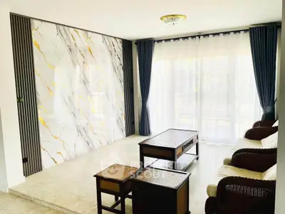 Elegant living room with marble accent wall and stylish furniture