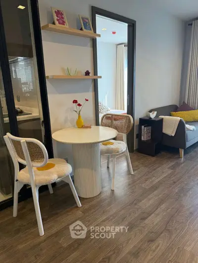 Charming living room with cozy dining area and stylish decor, perfect for modern living.