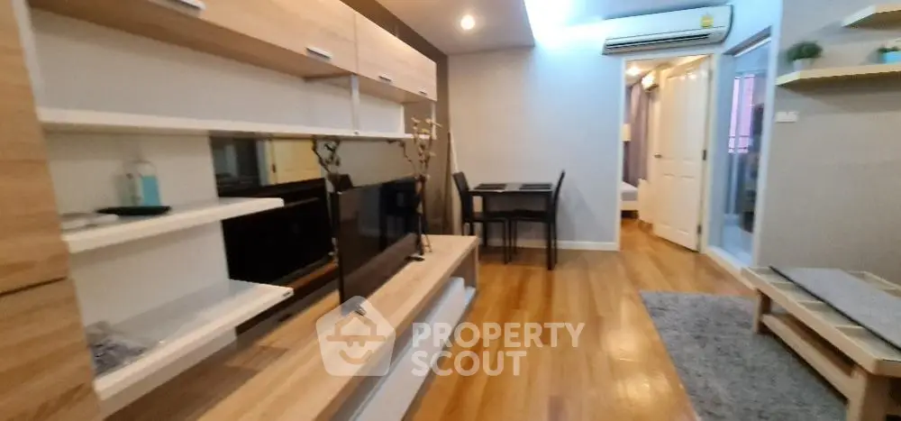 Modern living room with wooden flooring and stylish furniture