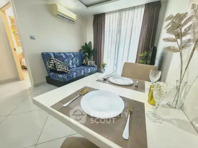 Chic living room with stylish decor and dining setup, perfect for modern living.