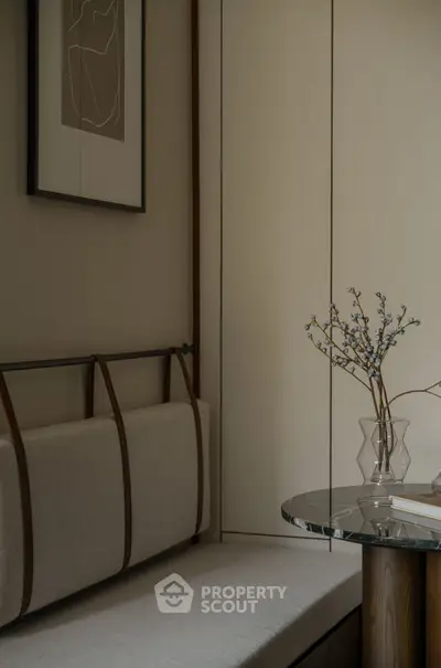 Elegant modern interior with stylish seating and glass table, perfect for sophisticated living.