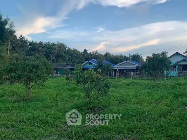Charming rural property with lush greenery and cozy homes, perfect for serene living.