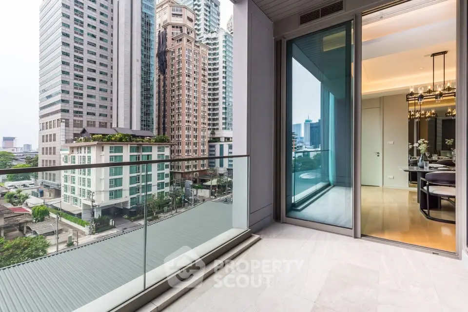 Luxurious high-rise apartment with spacious balcony and stunning city view, perfect for urban living.