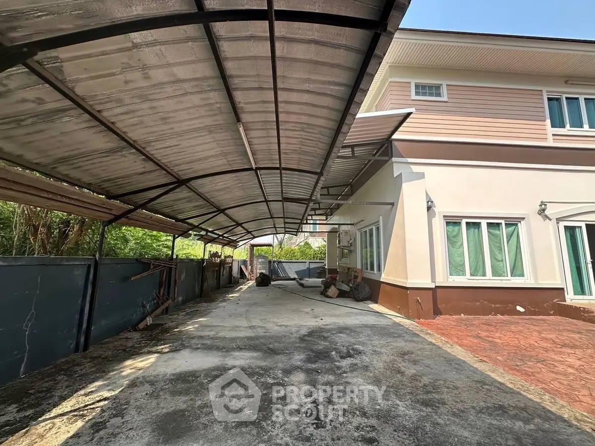 Spacious driveway with covered parking in a modern residential property
