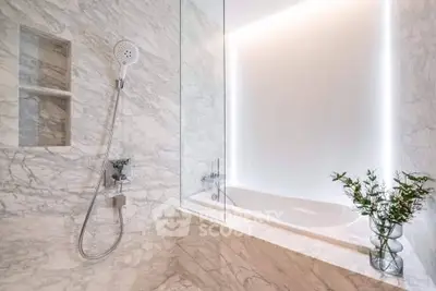 Luxurious marble bathroom with modern fixtures and elegant bathtub