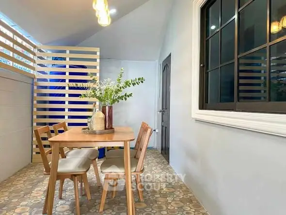 Charming dining area with modern wooden furniture and stylish decor