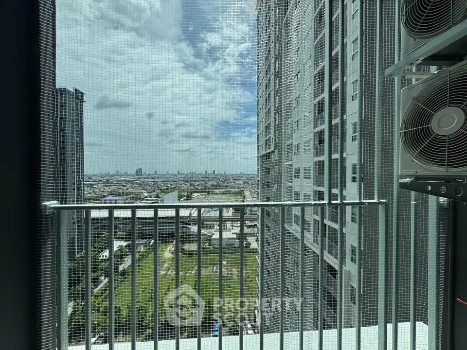 Stunning cityscape view from high-rise balcony with modern architecture and expansive skyline.