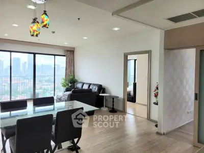 Spacious modern living room with city view and elegant dining area