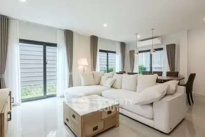 Spacious modern living room with elegant decor and large windows