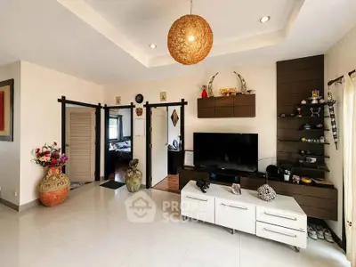 Spacious living room with modern decor and entertainment center
