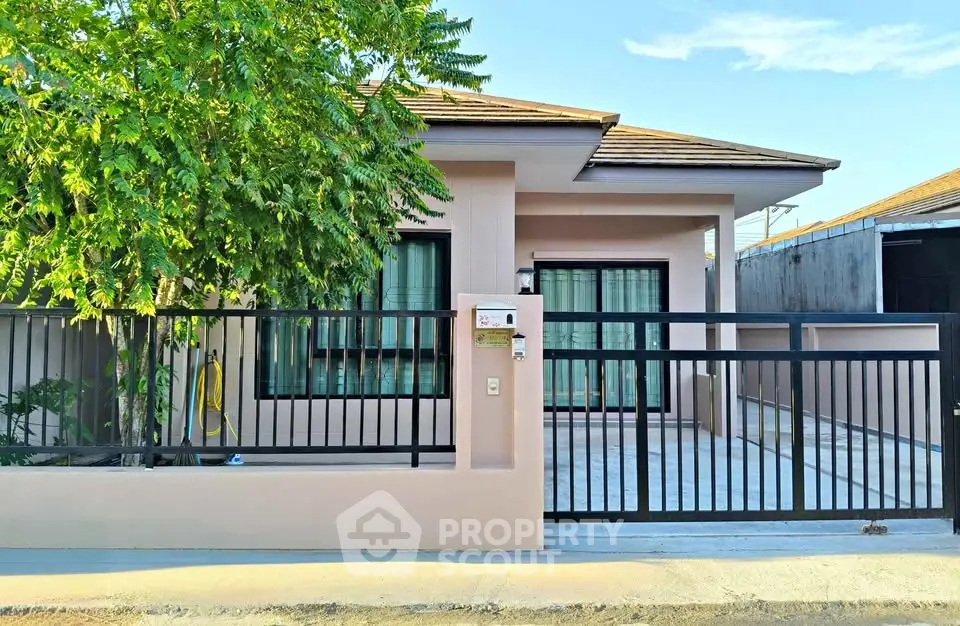 Charming single-story home with modern design and lush greenery, perfect for family living.