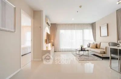 Spacious modern living room with elegant decor and natural light