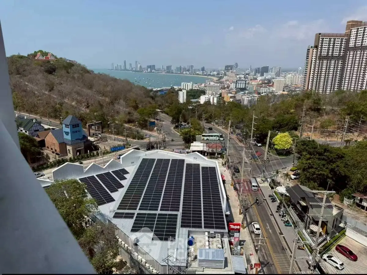Stunning aerial view of urban landscape with solar panels and city skyline, perfect for eco-friendly real estate investment.
