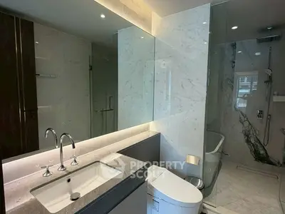 Luxurious modern bathroom with marble finishes and sleek fixtures