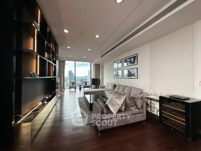 Luxurious modern living room with city view, elegant furniture, and sleek design in high-rise apartment.
