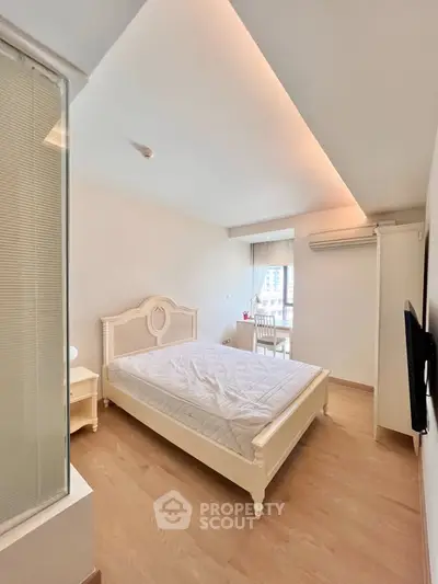 Bright and airy bedroom with elegant furnishings and modern decor