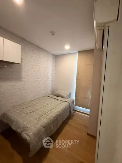 Cozy small bedroom with modern decor and natural light