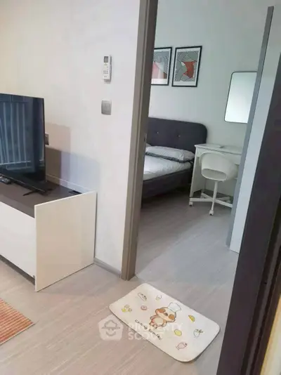 Modern apartment interior with cozy bedroom and stylish living area, perfect for urban living.