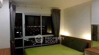 Modern bedroom with city view, featuring large windows and cozy lighting for a serene ambiance.