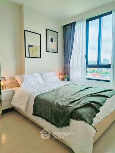 Modern bedroom with large window and stylish decor in urban apartment