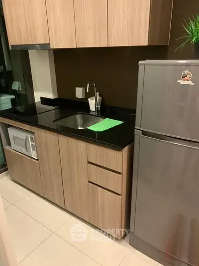 Modern kitchen with sleek cabinetry and stainless steel appliances