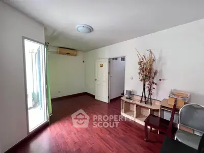 Spacious living room with wooden flooring and modern decor