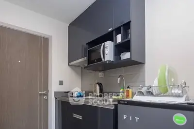 Modern compact kitchen with sleek cabinets and appliances