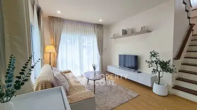 Modern living room with cozy decor and natural light