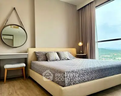 Modern bedroom with large window and stylish decor