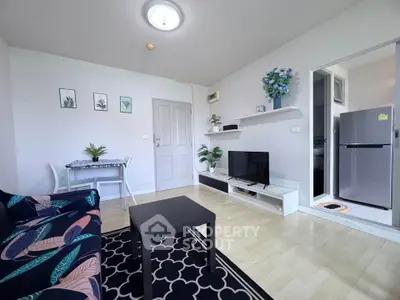 Bright and cozy living room with modern decor and adjacent kitchen area.
