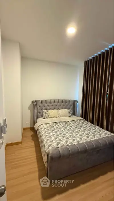 Cozy bedroom with elegant bed and modern decor in a stylish apartment.