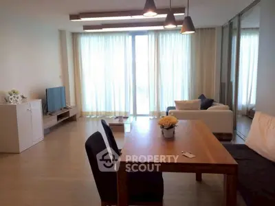 Spacious living room with modern decor and natural light