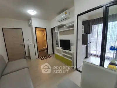 Modern apartment interior with living room, TV, and balcony view