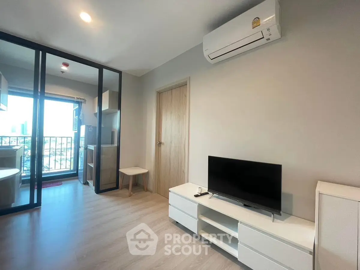 Modern living room with balcony view and sleek interior design