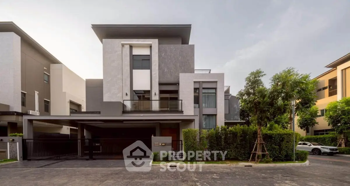 Modern luxury house exterior with sleek design and lush greenery, perfect for upscale living.